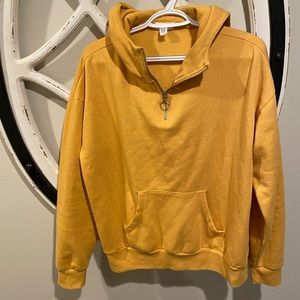 full tilt, yellow sweatshirt.